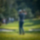 A golfer preparing to take a swing on a golf course.